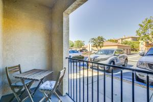 a balcony with a table and chairs and a parking lot at Modern Pet-Friendly San Diego Vacation Rental in San Diego