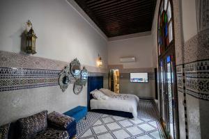 Postel nebo postele na pokoji v ubytování Riad Semlalia