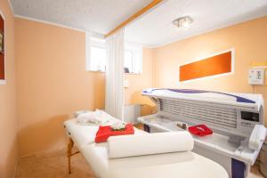 Postel nebo postele na pokoji v ubytování Hotel garni Zwickau-Mosel