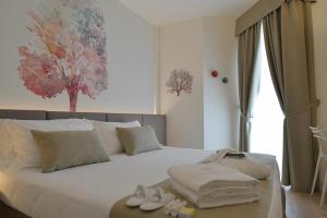 Postel nebo postele na pokoji v ubytování Hotel Elite + 37 fotografií