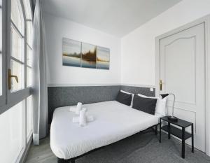 Postel nebo postele na pokoji v ubytování Stay U-nique Apartments GranDeGracia