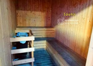 an inside of a sauna with a wooden floor at iCity Homestay 3pax 2BR Theme Park Water World Shah Alam 民宿 by FE Homestay in Shah Alam