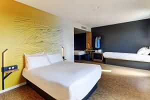 Postel nebo postele na pokoji v ubytování B&B HOTEL Dijon Valmy Toison d'or
