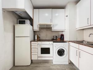 Kuchyň nebo kuchyňský kout v ubytování Stay U-nique Apartments GranDeGracia