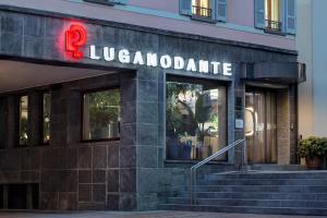 a building with a sign that reads liverpool caffe at LUGANODANTE Boutique & Lifestyle Hotel in Lugano