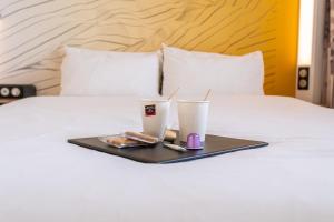 Postel nebo postele na pokoji v ubytování B&B HOTEL Argenteuil