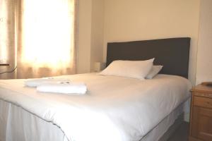 Postel nebo postele na pokoji v ubytování Charlie Hotel