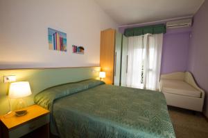 Postel nebo postele na pokoji v ubytování Hotel Mary Fleur