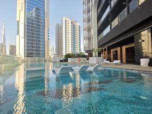 The swimming pool at or close to Vacay Lettings - 1BHK convertible to 2BHK in Business Bay