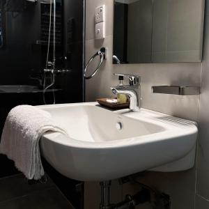 a white sink in a bathroom with a mirror at Cliveland Residence in Kandy +27 photos