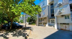 a car parked on a street next to a building at Apartment Focus in Mostar