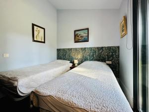 Postel nebo postele na pokoji v ubytování Serena CostaBravaSi