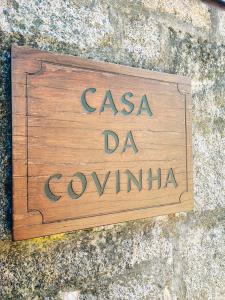 a sign that says csa daahoaho on a stone wall at Casa da Covinha - Branda da Aveleira in Melgaço