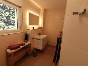 Ванна кімната в Ferienwohnung Am Wolfsweg