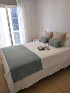 Giường trong phòng chung tại 0143 Apartamento nuevo y céntrico