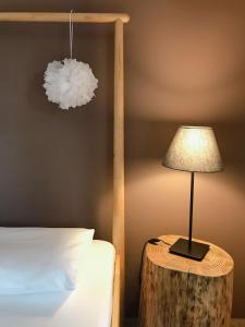 A bed or beds in a room at Agrilia Maison