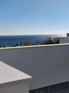 a view of the ocean from the balcony of a building at Benalmadena new terraced house 3 bedroom 2,5 bathroom in Benalmádena