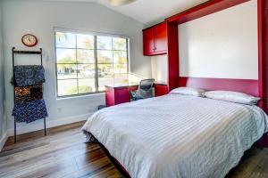 a bedroom with a large bed and a window at Spacious Arizona Getaway with Pool, Pets Welcome! in Surprise +27 photos