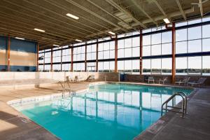 a large pool with blue water in a building at Niagara Riverside Resort; BW Premier Collection in Niagara Falls