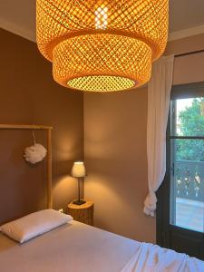 A bed or beds in a room at Agrilia Maison