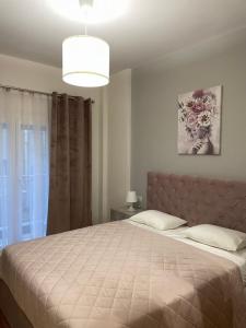 Ένα ή περισσότερα κρεβάτια σε δωμάτιο στο Sofmare City Apartment
