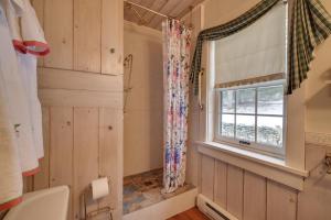 a bathroom with a window and a sink at Cabin Vacation Rental about 8 Mi to Penn State! in State College
