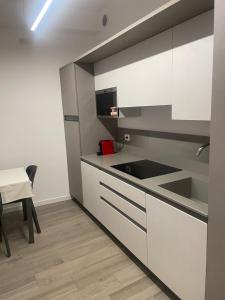 A kitchen or kitchenette at Residenza della Samaritana Classici