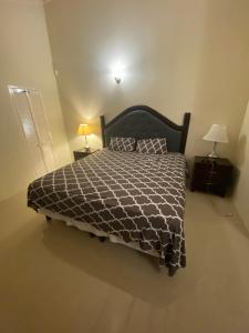 Ένα ή περισσότερα κρεβάτια σε δωμάτιο στο Villa Oasis Drax Hall +40 φωτογραφίες