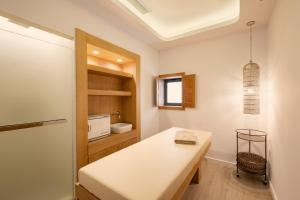 a kitchen with a white table in a room at Erato by Samian Mare in Karlovasi