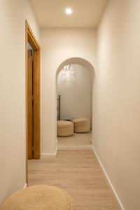 a hallway with two beds in a room at Erato by Samian Mare in Karlovasi