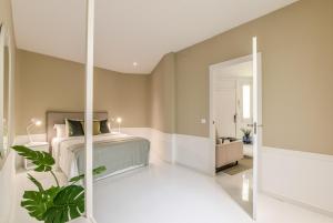A bed or beds in a room at Apartamento Embajadores X