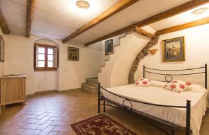 a bedroom with a bed in a room with stairs at ClickSardegna Cottage Asaje ad Alghero con piscina ad uso esclusivo in Alghero +58 photos