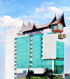 a hotel building with a roof on top of it at Balairung Hotel Jakarta in Jakarta