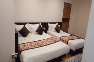 Hotel Ninamma客房内的一张或多张床位