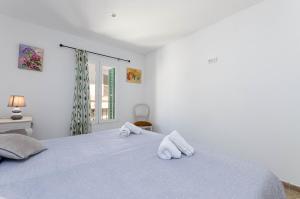 Łóżko lub łóżka w pokoju w obiekcie YourHouse Ca Na Mosseta