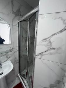 a bathroom with a shower and a sink at Jacks Apartment in Paphos City
