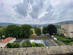 a view of a parking lot from a building at Great Pulteney St. Maisonette (parking) in Bath