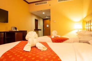Postel nebo postele na pokoji v ubytování Grand Central Hotel