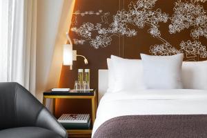 Un ou plusieurs lits dans un hébergement de l'établissement Hotel Washington
