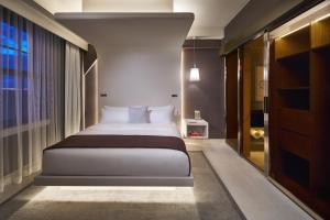 Un ou plusieurs lits dans un hébergement de l'établissement Hotel Washington