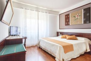 Posteľ alebo postele v izbe v ubytovaní Colleverde Park Hotel