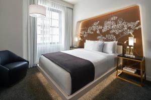 מיטה או מיטות בחדר ב-Hotel Washington