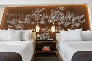 Un ou plusieurs lits dans un hébergement de l'établissement Hotel Washington