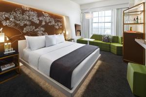 Un ou plusieurs lits dans un hébergement de l'établissement Hotel Washington