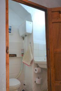 a bathroom with a toilet and a sink at La guarida rústica del zorro in Jijona +58 photos