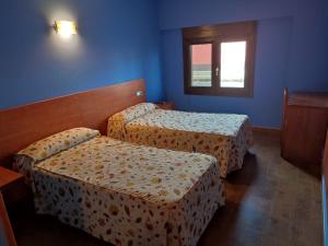 Postel nebo postele na pokoji v ubytování Pension Urola