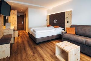 Posteľ alebo postele v izbe v ubytovaní Hotel Edelweiss Superior