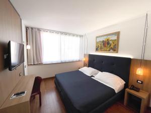 Posteľ alebo postele v izbe v ubytovaní Colleverde Park Hotel