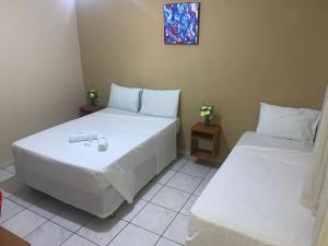 Postel nebo postele na pokoji v ubytování Hotel Sambaquis + 30 fotografií