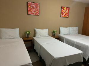 Uma cama ou camas num quarto em Hotel Sambaquis